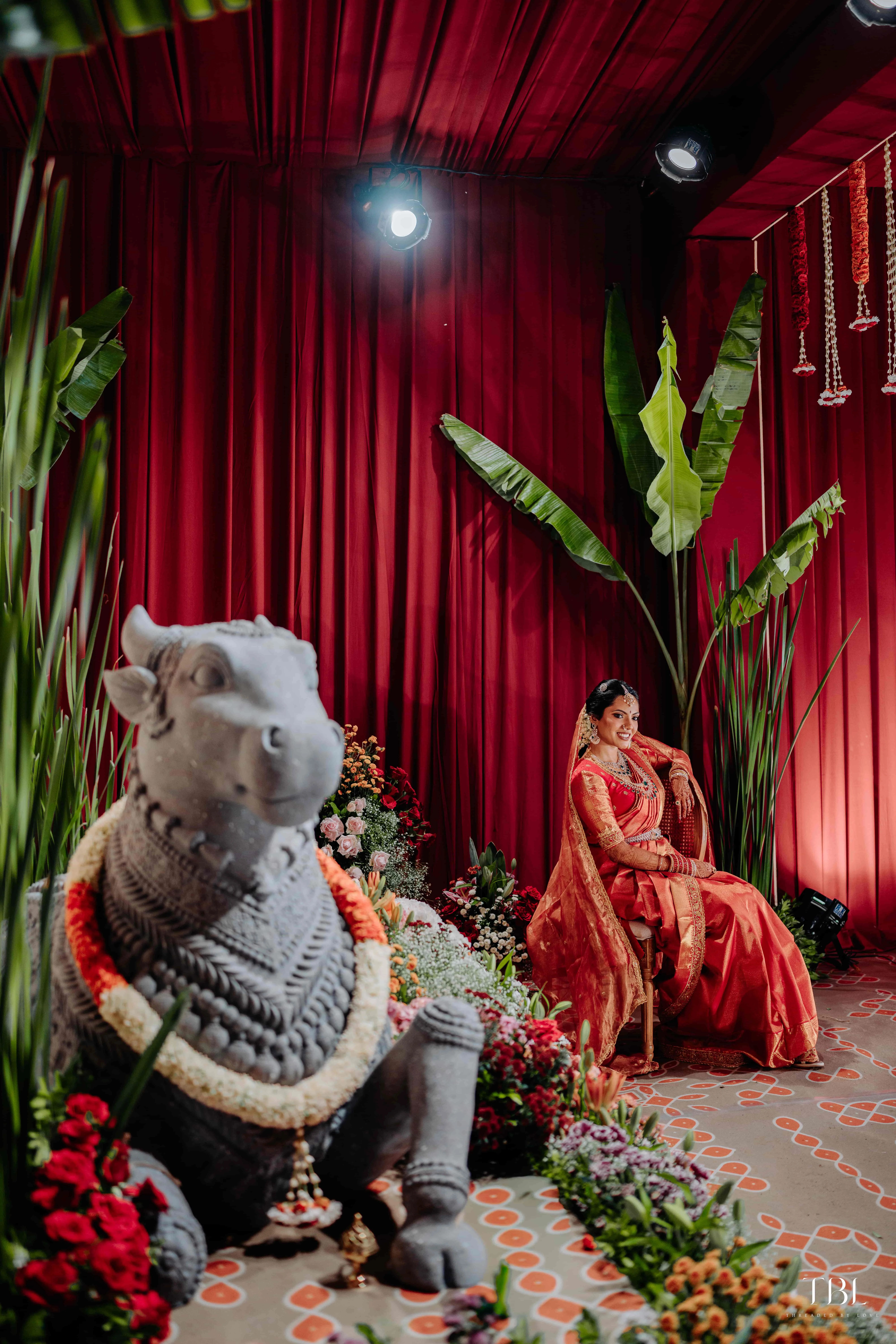 Traditional Telugu wedding decor captured at night with a dramatic twilight sky